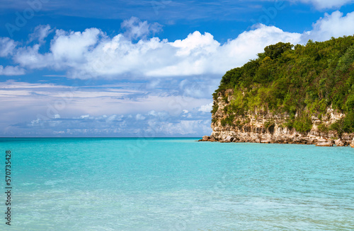 Tropical paradise landscape with ocean bluff and clear waters © MMPhoto21