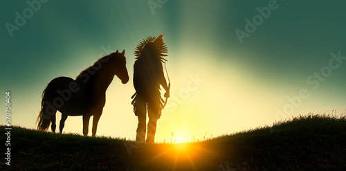 Indian of America on horseback at sunset photo