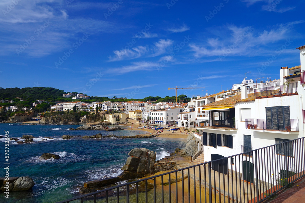 view along the beaches and coast in Calella de Palafrugell, where the historic houses rise to the sea, Costa Brava, Girona, Catalonia, Spain	