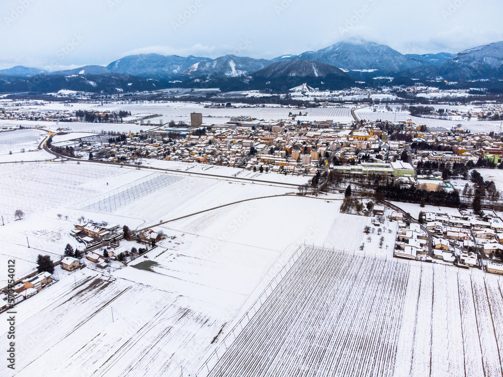 Drone view of a rural Slovenian town Zalec, covered in snow