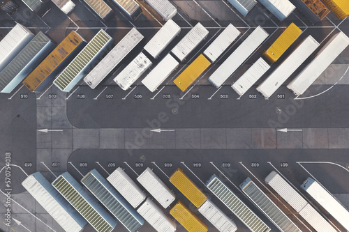 Top view of trucks with a trailer, large parking lot for trailers, transportation company