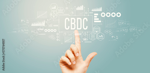 CBDC - Central Bank Digital Currency Concept with hand pressing a button on a technology screen