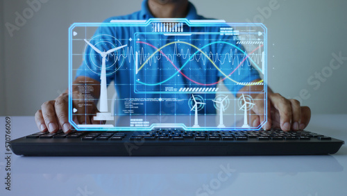 Engineer using AI hologram to monitor the power parameters of a wind turbine generator in real time. Artificial intelligence aids in the analysis and resolution of energy-related issues. Green power photo