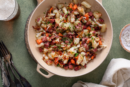 Corned beef hash with potatoes, cabbage and carrot photo