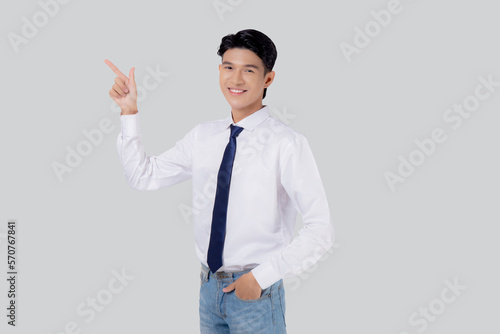 Portrait young asian business man pointing and presenting isolated on white background  advertising and marketing  executive and manager  male confident showing success  expression and emotion.