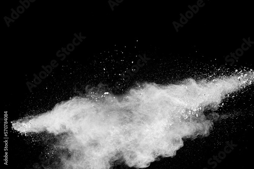 Fototapeta Naklejka Na Ścianę i Meble -  White powder explosion clouds.Freeze motion of white dust particles splash on black background.