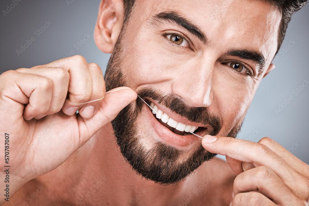 Φωτογραφία Floss, cleaning teeth and portrait of man in studio for beauty, healthy body and hygiene on background