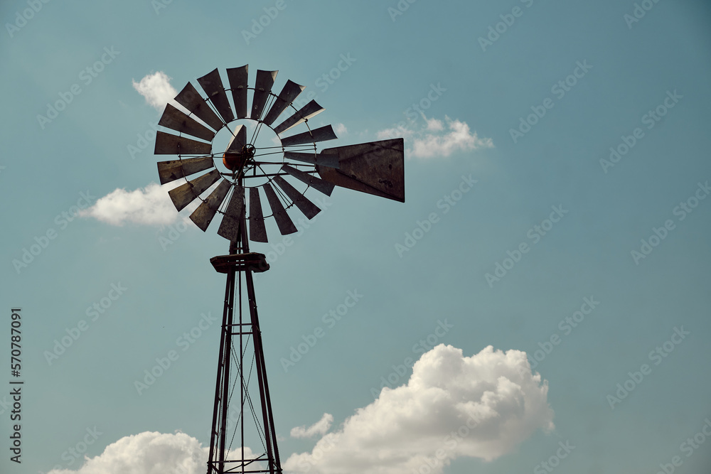 silhouette of an old and weathered windmill typical for rural america silhouette of an old and weathered windmill typical for rural america