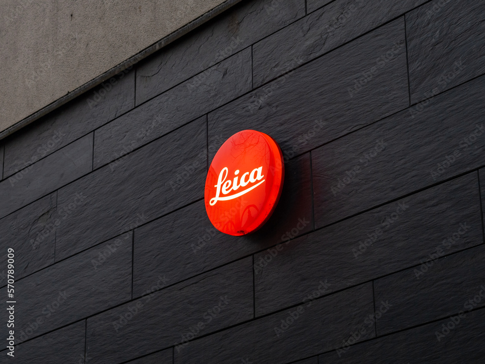 FRANKFURT, GERMANY - 31. January 2023: Leica camera logo on a dark wall.  Premium photography equipment store and gallery. High quality products for  wealthy people and professionals. Stock Photo | Adobe Stock