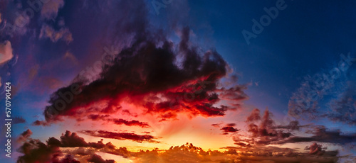 amazing stunning colorful sunset, panoramic view of cloudy skies in sunset colors, Bali © everigenia