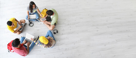 Students with modern devices studying online indoors, top view. Banner for design