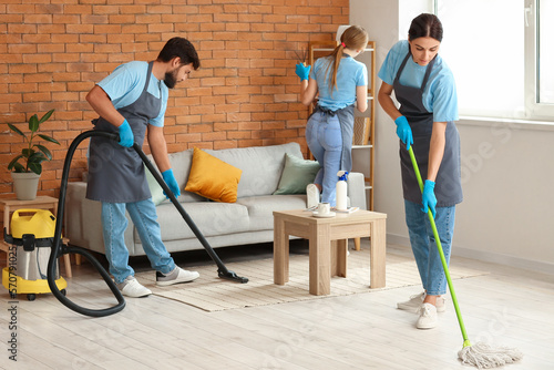 Young janitors cleaning in ...
