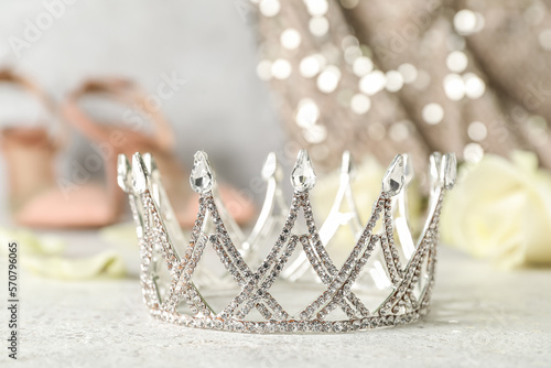 Beautiful tiara on white table, closeup. Prom concept