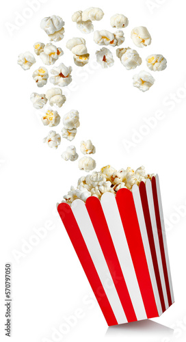 popcorn flying out red and white cardboard bucket isolated on white