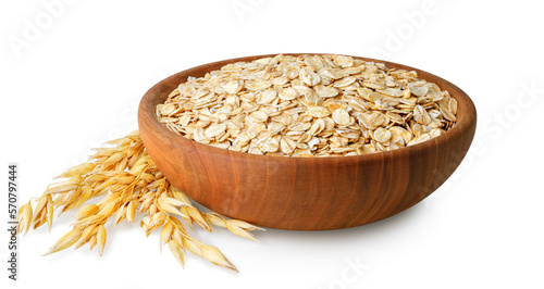 oatmeal in bowl and oat ears near isolated on white background photo