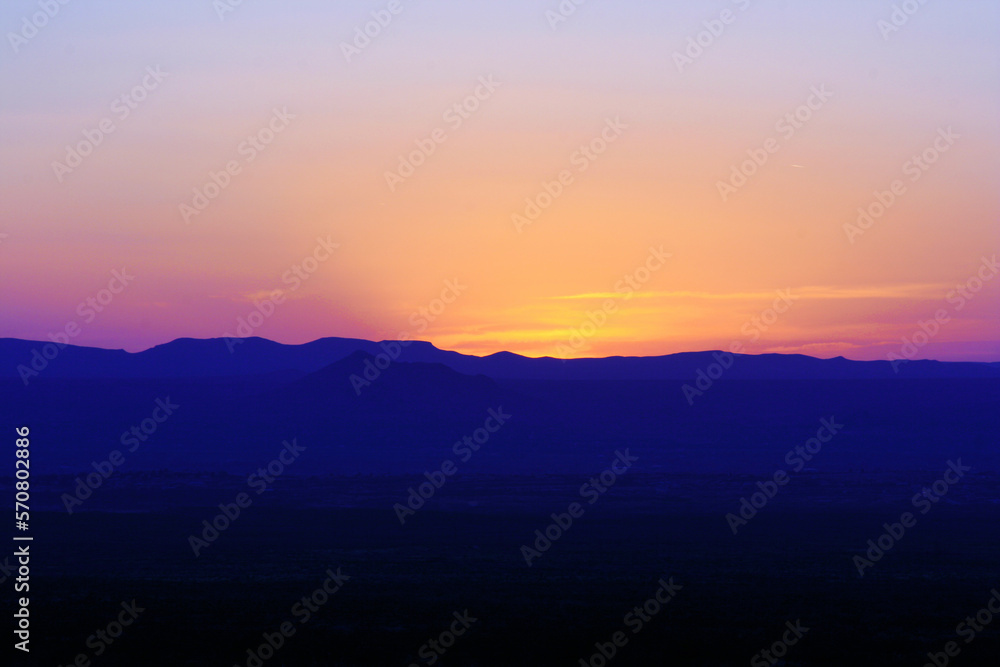 new mexico desert sunset with mountains foreground