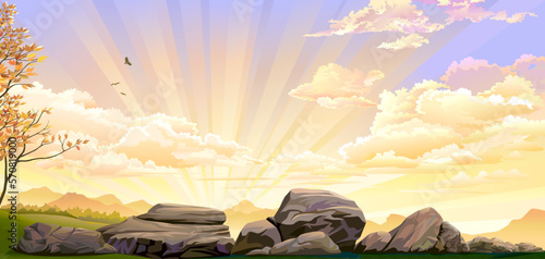 Big rocks on green meadows with sunset in the background.