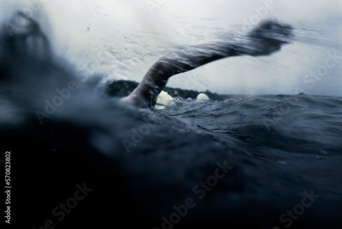 Endurance of an open water swimmer in a race photo