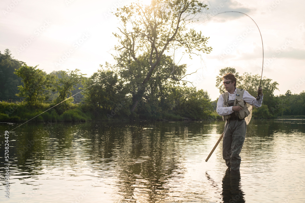 Flyfishing at sunset on a Southeastern river Flyfishing at sunset on a Southeastern river