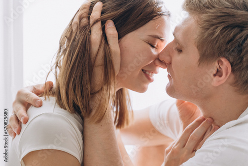Close-up of a couple of lovers kissing on a white background photo