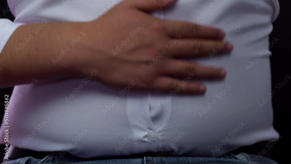Fat man checking out his weight in diet concept
Fat man checking out his weight in diet concept