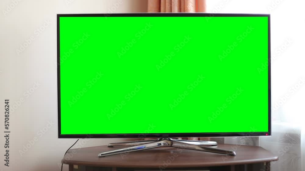 Large TV in the apartment with a chroma key screen. Large TV in the apartment with a chroma key screen.