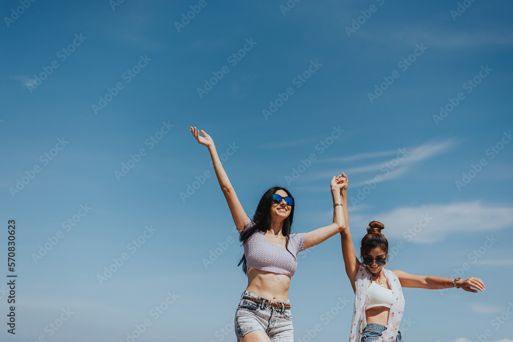Happiness woman and friends having fun and enjoyment on summer beach. teenagers female dancing together at tropical beach on weekend. friendship and freedom. Happiness woman and friends having fun and enjoyment on summer beach. teenagers female dancing together at tropical beach on weekend. friendship and freedom.
