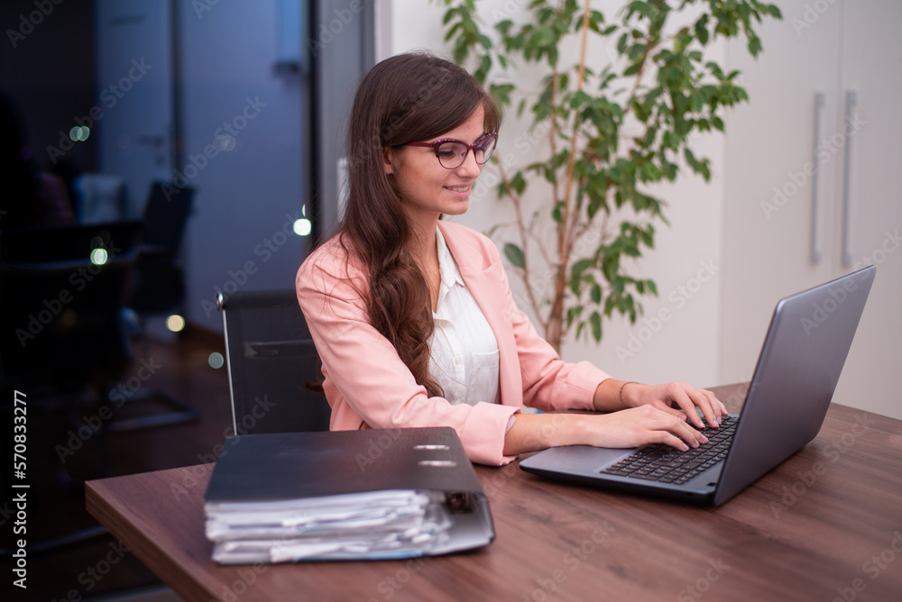 Young businesswoman working on her laptop Young businesswoman working on her laptop