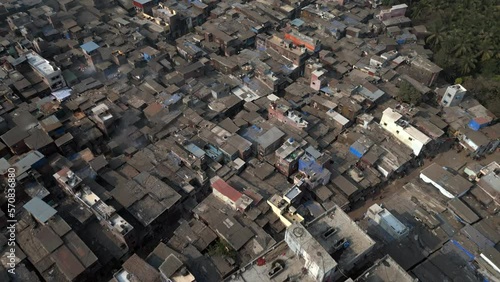 Aerial view flying over the Dharavi slums in Mumbai, Maharashtra, India. Dharavi is considered to be one of the largest slums in the world and the largest in Asia.	
