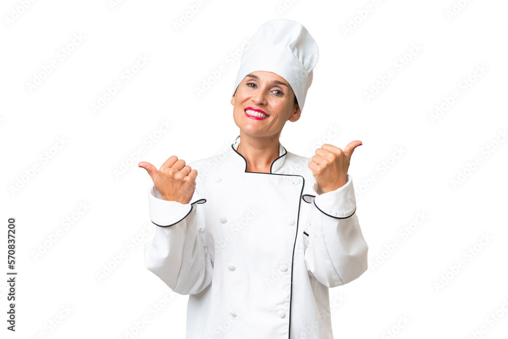 Middle-aged chef woman over isolated background with thumbs up gesture and smiling Middle-aged chef woman over isolated background with thumbs up gesture and smiling