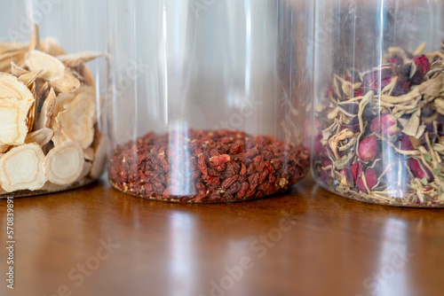 Close-up dried goji berries, roses and astragalus