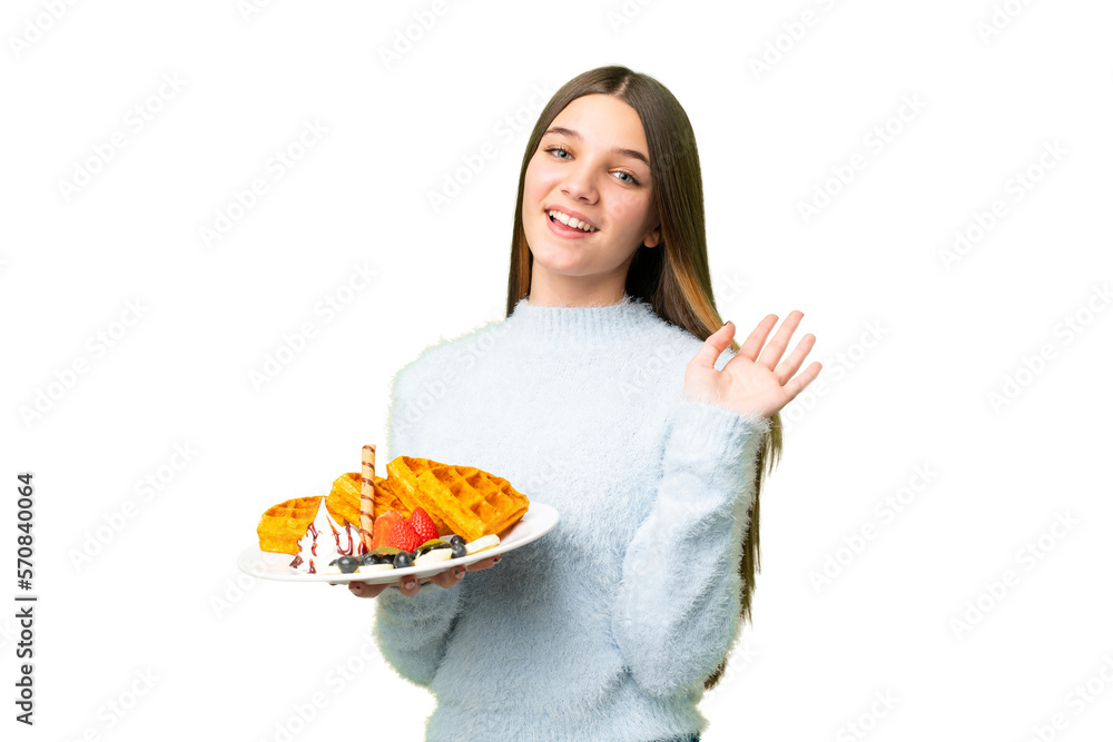 Teenager girl holding waffles over isolated chroma key background saluting with hand with happy expression Teenager girl holding waffles over isolated chroma key background saluting with hand with happy expression