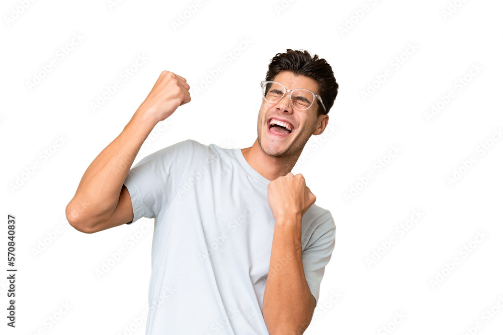 Young caucasian handsome man over isolated background celebrating a victory Young caucasian handsome man over isolated background celebrating a victory