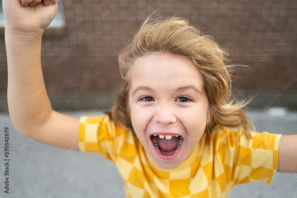Enraged kid boy with angry expression. Angry hateful little aggression
