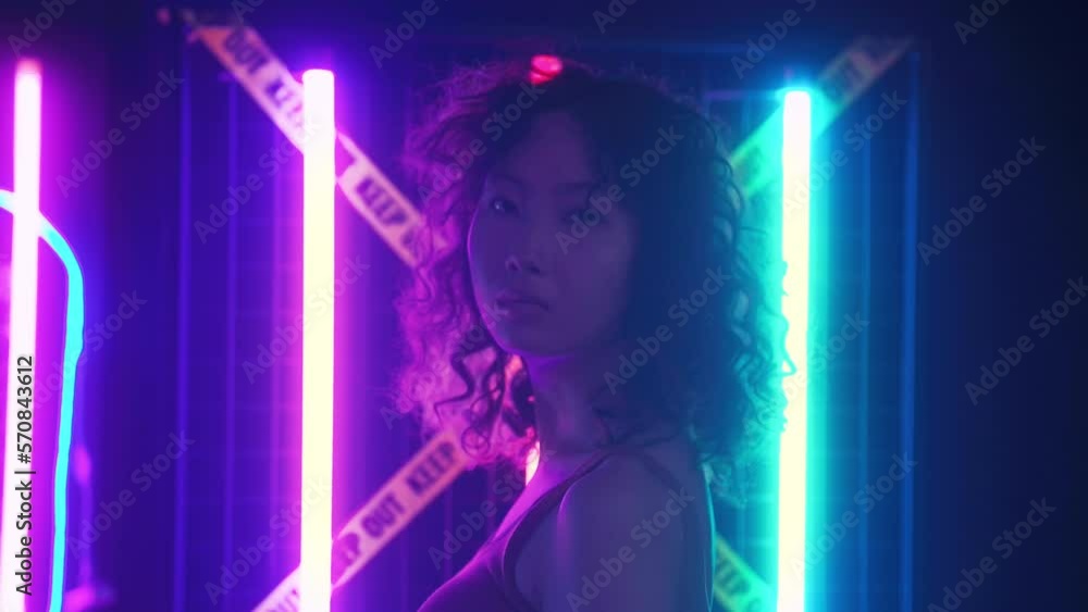 Portrait of Asian young woman in game online streaming room , neon lights background . Futuristic technology concept. Portrait of Asian young woman in game online streaming room , neon lights background . Futuristic technology concept.