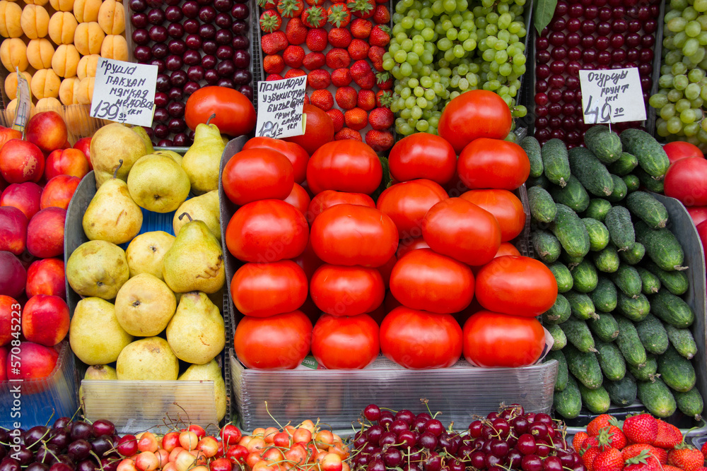 Pears, cucumbers, tomatoes and berries on the market