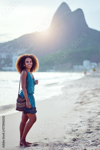 beautiful young brazilian woman on the shore of the beach full body portrait Ipanema, Rio de Janeiro 