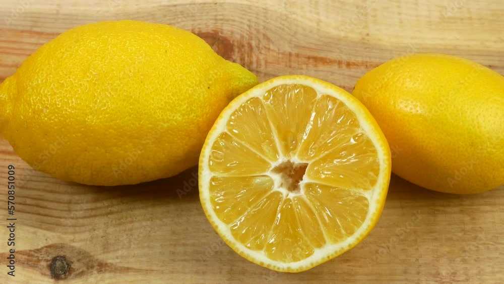 Many fresh fruits lie on the table. Beautiful lemons for healthy eating. Citruses lie beautifully on a white table. Many fresh fruits lie on the table. Beautiful lemons for healthy eating. Citruses lie beautifully on a white table.