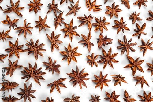 A lot of star anise on a white background close-up