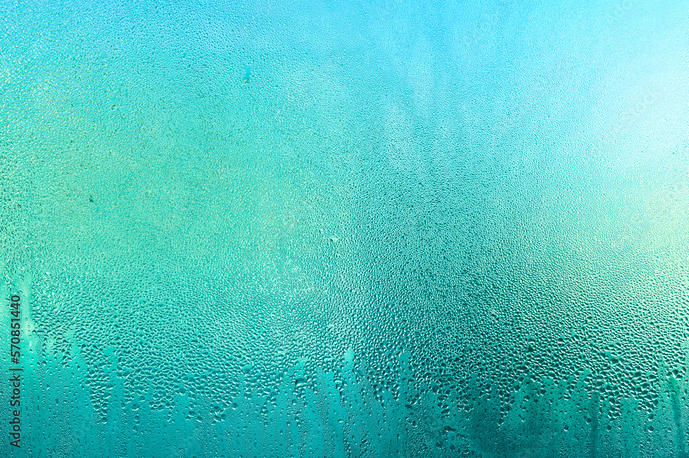 Background of water drops, condensation on the glass. water drops on a blue turquoise background.