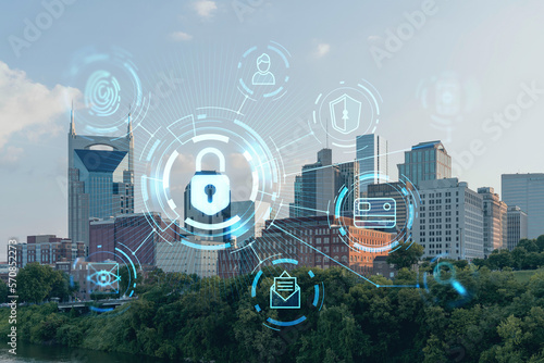Panoramic skyline view of Broadway district of Nashville over Cumberland River at day time, Tennessee, USA. Glowing Padlock hologram. The concept of cyber security to protect confidential information