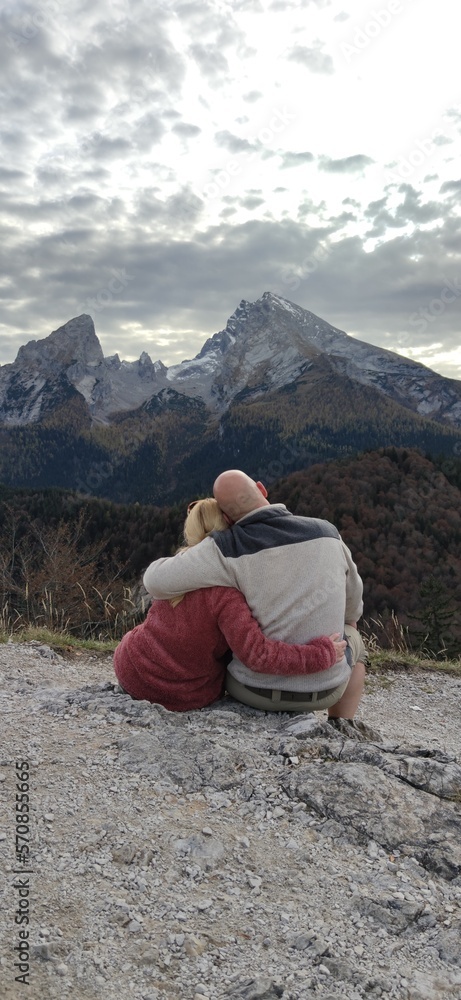 Fototapeta premium person sitting on a mountain top