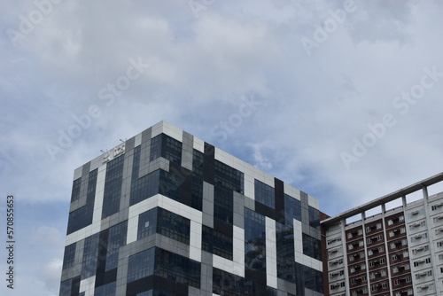 modern office building with clouds