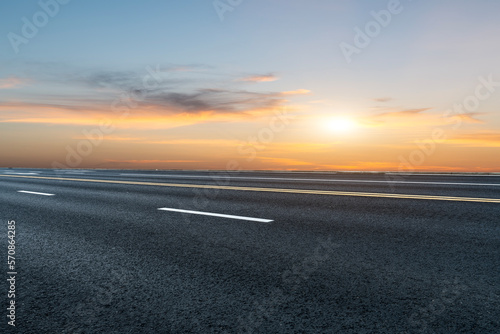 Asphalt road and sky at sunset
