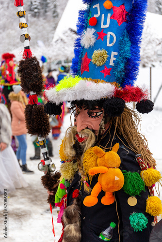 Gody Zywieckie - traditional winter parade of 'Dziady', folk custom in Zywiec region, man dressed in traditional colorful costume of a Jew, Milowka, Poland