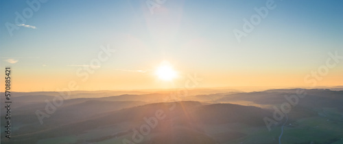 calm and simplistic sunset over the mountains background