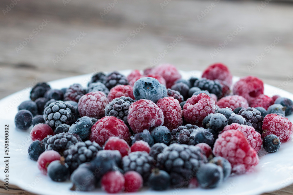 Frozen berries in a bowl, close-up Frozen berries in a bowl, close-up