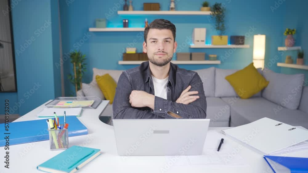 Young man working from laptop looks at camera confident and happy.
Young man working from laptop and looking confidently at camera, smiling.
Young man working from laptop looks at camera confident and happy.
Young man working from laptop and looking confidently at camera, smiling.