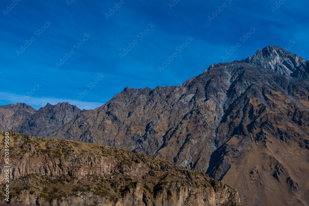 Georgia : 10-11-2022 : Country of Georgia, Kazbegi, Panoramic landscape of beautiful natural mountains, view of amazing Caucasus mountain peaks and meadows in Kazbegi national park