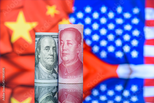 Trade tension, trade war, commercial conflict between US and China, economic concept : US dollar bill and Chinese yuan. Depicting a significant deterioration in the relationship between US and China. photo